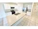 Bright and airy kitchen featuring ample countertop space and sleek stainless steel appliances at 2837 Palatino Lane, Tavares, FL 32778