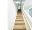 Carpeted staircase with white railing leading to the upper level at 2837 Palatino Lane, Tavares, FL 32778