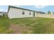 The home features a lush backyard with room to add your personal touch to the outdoor living space at 3069 Cassidy Ln, Haines City, FL 33844