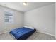 Neutral bedroom with a gray carpet, a bed and window at 3069 Cassidy Ln, Haines City, FL 33844