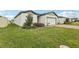 Charming one-story home with a well-manicured lawn, and a spacious two-car garage at 3069 Cassidy Ln, Haines City, FL 33844