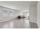 Bright and airy living room features a comfortable sofa, large windows, and tiled flooring at 3069 Cassidy Ln, Haines City, FL 33844