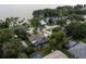 Aerial view of a lovely lakeside community with mature trees and private docks at 3111 Indian Trl, Eustis, FL 32726