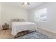 Bright bedroom with neutral walls, area rug, and natural light offers a soothing retreat at 3111 Indian Trl, Eustis, FL 32726