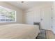 This bedroom features a large window and a closet with double doors at 3111 Indian Trl, Eustis, FL 32726