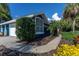 Charming blue home featuring a well-maintained lawn and a beautiful, arched window at 3111 Indian Trl, Eustis, FL 32726