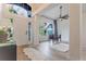 Bright foyer featuring a high ceiling, white door, and luxury vinyl flooring at 3111 Indian Trl, Eustis, FL 32726