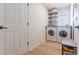 Bright laundry room with side by side washer and dryer at 3111 Indian Trl, Eustis, FL 32726