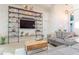 Inviting living room with modern shelving, comfortable seating, and abundant natural light at 3111 Indian Trl, Eustis, FL 32726