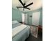 Comfortable bedroom featuring soft blue walls and a ceiling fan at 3117 Shady Pine Ave, Winter Park, FL 32792