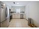 Bright kitchen with stainless steel appliances, white cabinetry, and a large window for ample natural light at 3117 Shady Pine Ave, Winter Park, FL 32792