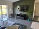 Relaxing living room featuring a large window with views of the outdoors at 3117 Shady Pine Ave, Winter Park, FL 32792