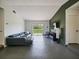 Bright living room with a large sliding glass door to the back yard, letting in ample natural light at 3117 Shady Pine Ave, Winter Park, FL 32792