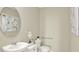 Elegant bathroom featuring modern fixtures, a decorative mirror, and a comfortable toilet at 3456 Costello Cir, Winter Haven, FL 33884