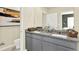 Elegant bathroom with double granite vanity and decorative touches for a modern look at 3456 Costello Cir, Winter Haven, FL 33884