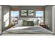 Comfortable bedroom with a plush bed, decorative pillows, and natural light from two windows at 3456 Costello Cir, Winter Haven, FL 33884