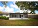 The backyard has a screened-in patio for enjoying the outdoors at 380 Banyan Dr, Maitland, FL 32751