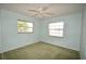 Bedroom with a ceiling fan and natural light from two windows at 380 Banyan Dr, Maitland, FL 32751
