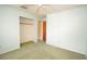A bright bedroom features a ceiling fan and an ample closet space at 380 Banyan Dr, Maitland, FL 32751