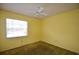 Bedroom with a ceiling fan and window letting in natural light at 380 Banyan Dr, Maitland, FL 32751