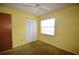 Bright bedroom with a ceiling fan, closet, and natural light from a window at 380 Banyan Dr, Maitland, FL 32751