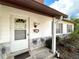 Inviting front entrance featuring the front door, house number, and well-maintained siding at 380 Banyan Dr, Maitland, FL 32751