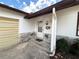 Welcoming front entrance showing the front door, house number, and stone veneer accents at 380 Banyan Dr, Maitland, FL 32751