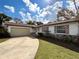 Well-kept single-story house showcasing a neat lawn, paved driveway, and attached garage at 380 Banyan Dr, Maitland, FL 32751