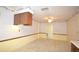 Eat-in kitchen features tile flooring, wooden cabinetry, and a ceiling fan for added comfort at 380 Banyan Dr, Maitland, FL 32751