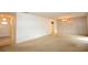 Spacious living room with carpet, neutral walls, and a view into other rooms at 380 Banyan Dr, Maitland, FL 32751