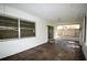 The tiled patio offers a shaded seating area and screened enclosure at 380 Banyan Dr, Maitland, FL 32751