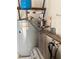 Utility room with water heater, shelving, and other components at 380 Banyan Dr, Maitland, FL 32751