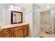 Bathroom featuring marble counters, a framed mirror, and tiled floors at 4036 Shannon Brown Dr, Orlando, FL 32808