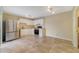This kitchen offers tile flooring, stainless steel refrigerator, and white cabinetry at 4036 Shannon Brown Dr, Orlando, FL 32808