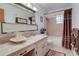 Traditional bathroom featuring tiled walls, a shower-tub combo, and a single vanity with a white countertop at 4155 Westgate Rd, Orlando, FL 32808