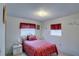 Bright bedroom featuring a comfortable bed, decorative curtains, and a cozy atmosphere at 4155 Westgate Rd, Orlando, FL 32808
