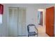 Bedroom featuring closet space, neutral walls, and transition to the en-suite bathroom at 4155 Westgate Rd, Orlando, FL 32808