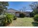 Charming single-story home with a well-maintained lawn and mature landscaping at 4155 Westgate Rd, Orlando, FL 32808