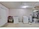 Functional laundry area featuring a washer, dryer, and utility sink for added convenience at 4155 Westgate Rd, Orlando, FL 32808