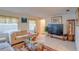 Cozy living room with large windows, tile floors, and comfortable furniture at 4155 Westgate Rd, Orlando, FL 32808