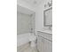 Stylish bathroom with updated fixtures, tiled shower, and modern vanity at 4536 San Sebastian Cir, Orlando, FL 32808