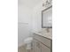Updated half bath with modern vanity, neutral color palette, and sleek fixtures at 4536 San Sebastian Cir, Orlando, FL 32808