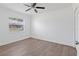 Clean, updated bedroom with neutral paint, new floors, and a ceiling fan at 4536 San Sebastian Cir, Orlando, FL 32808