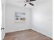 This bedroom features wood-look floors, white trim and a window with blinds at 4536 San Sebastian Cir, Orlando, FL 32808