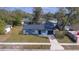 Charming single-story home with well-manicured lawn and a black door and a one car garage at 4536 San Sebastian Cir, Orlando, FL 32808