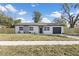 Charming single-story home with a freshly painted exterior and well-manicured lawn at 4536 San Sebastian Cir, Orlando, FL 32808