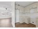 Open kitchen with white cabinets, subway tile backsplash, and wood-look flooring at 4536 San Sebastian Cir, Orlando, FL 32808