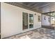 A beautiful screened patio features an exterior door and access to the backyard at 4536 San Sebastian Cir, Orlando, FL 32808