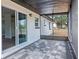 Enclosed patio with tile pavers, offering a comfortable and stylish outdoor space at 4536 San Sebastian Cir, Orlando, FL 32808