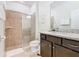 Modern bathroom boasts a glass-enclosed shower, granite countertop, and vanity at 4594 Terrasonesta Dr, Davenport, FL 33837